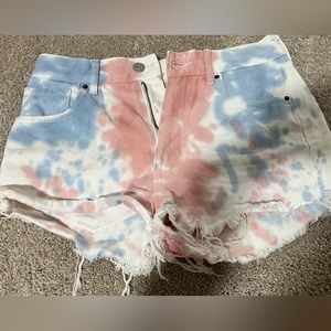white jean shorts with red and blue tie dye